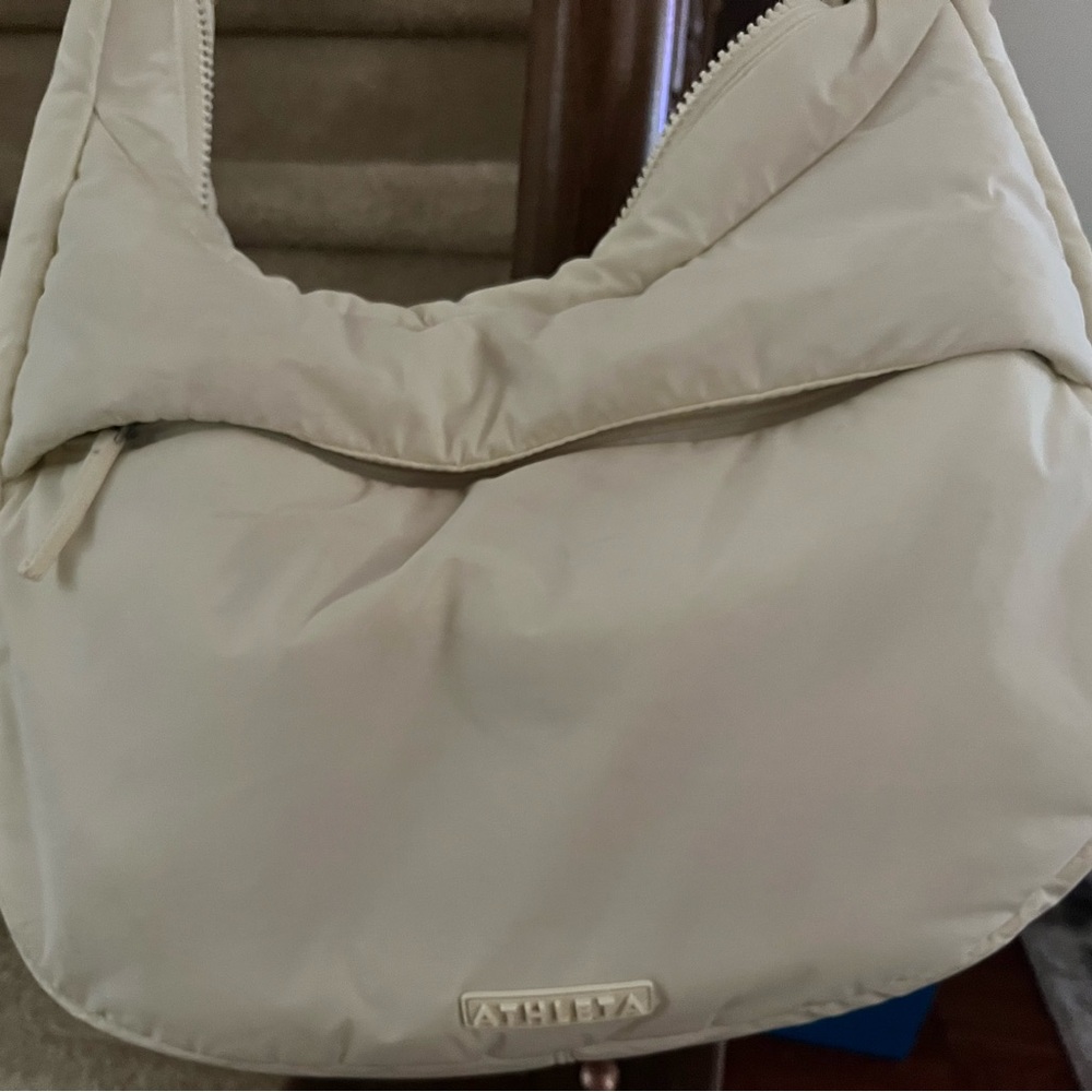 Excellent Condition Athleta All About Medium Crossbody Hobo Bag. Light yellow